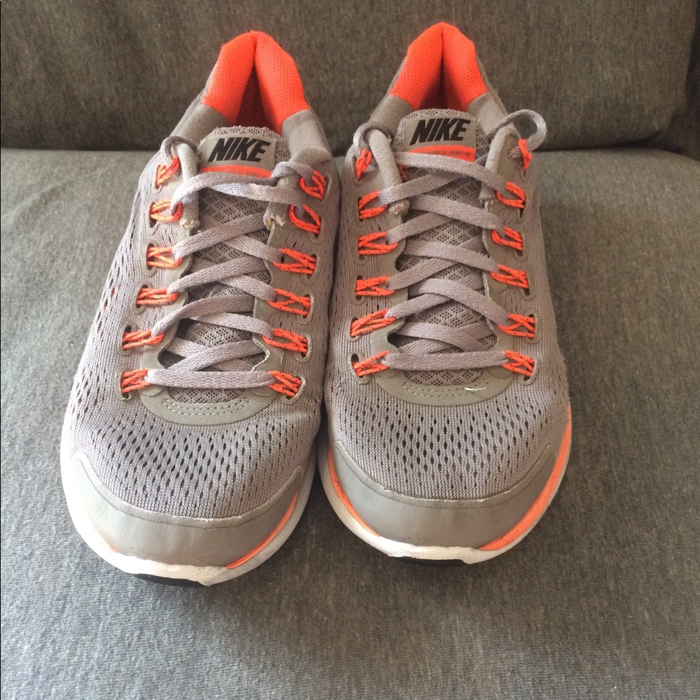 Gray and orange tennis shoes